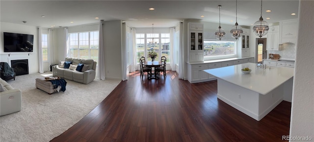 2490 Sagebrush St, Parker, CO 80138 - living area featuring dark wood finished floors, a fireplace, and recessed lighting