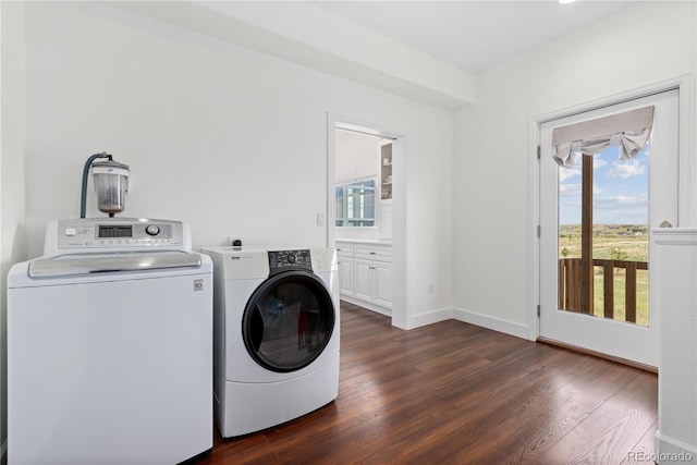 2490 Sagebrush St, Parker, CO 80138 - washroom with washer and clothes dryer and dark wood-type flooring