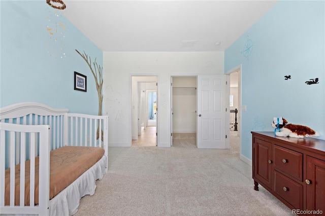 2490 Sagebrush St, Parker, CO 80138 - bedroom with light colored carpet and a walk in closet