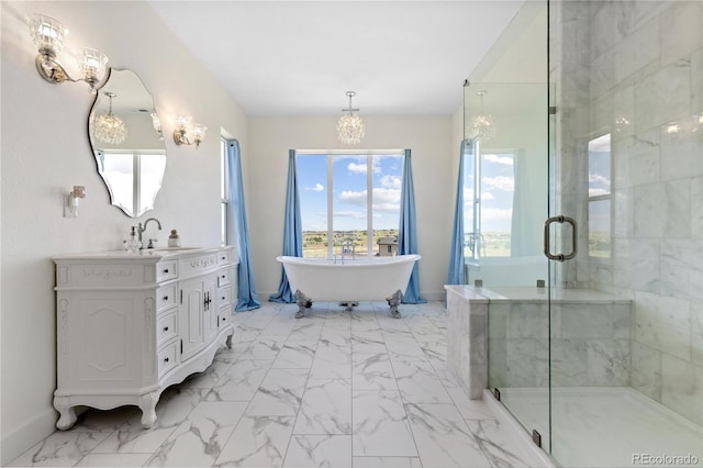 2490 Sagebrush St, Parker, CO 80138 - full bath with a chandelier, vanity, a freestanding bath, a stall shower, and marble look tiles