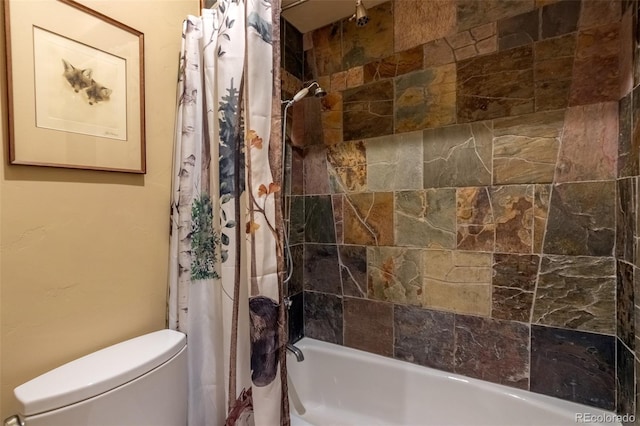 bathroom featuring toilet and shower / tub combo