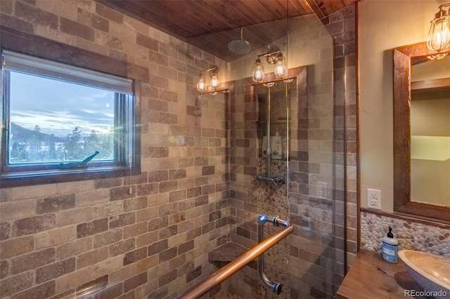 bathroom with vanity, wooden ceiling, and a shower with door