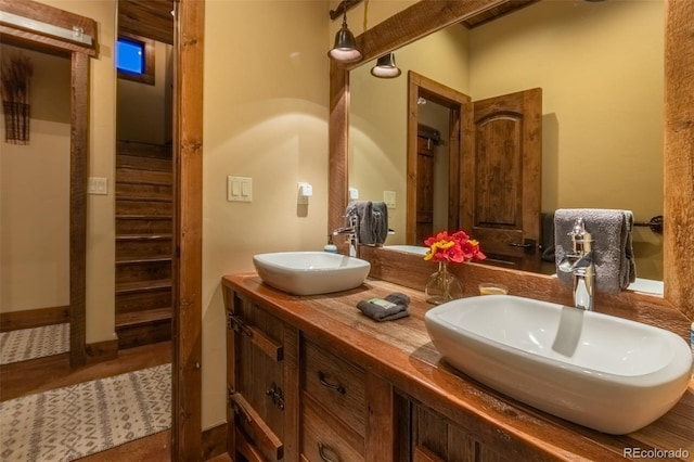 bathroom with tile patterned floors and vanity