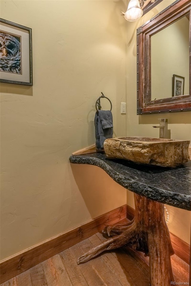 bathroom featuring sink and wood-type flooring