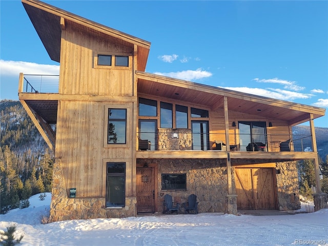 view of front of home with a balcony