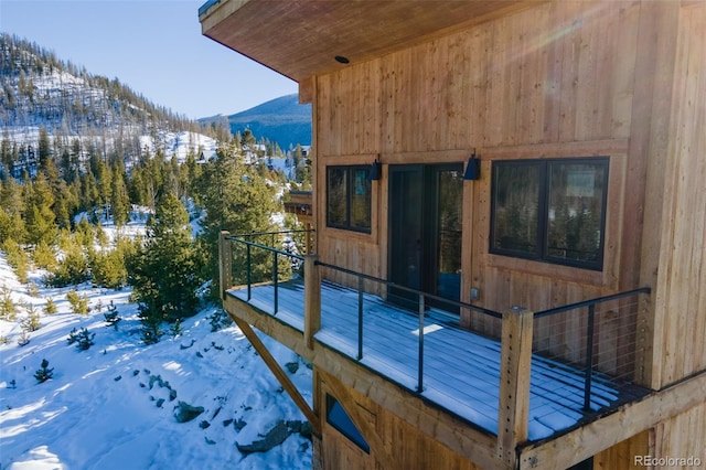 exterior space featuring a mountain view and a balcony