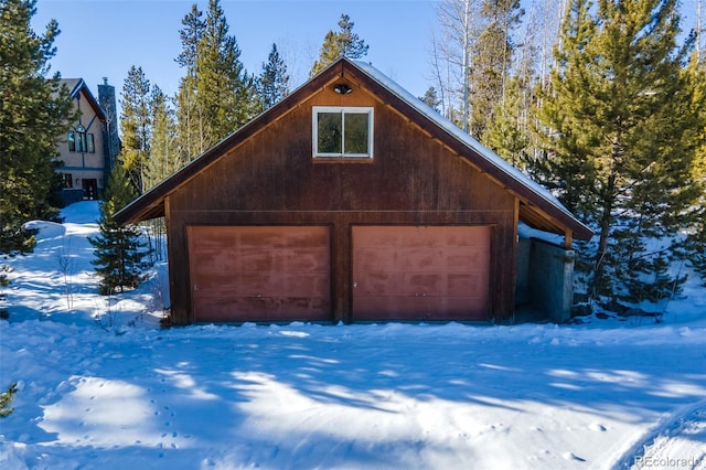 view of snow covered garage