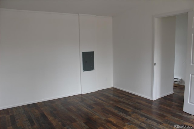 1692 US Highway 24, Leadville, CO 80461 - spare room with a baseboard heating unit, dark wood finished floors, electric panel, and baseboards