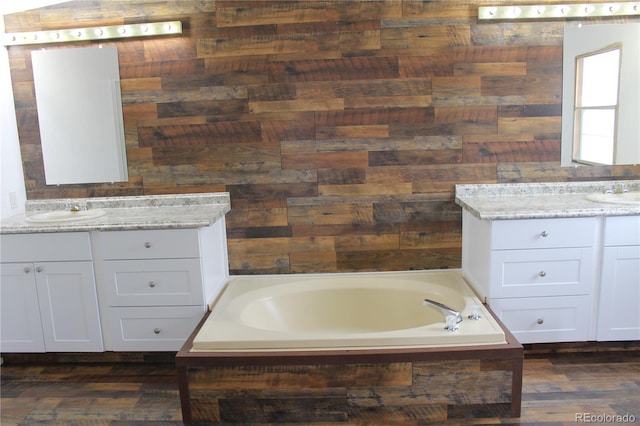 1692 US Highway 24, Leadville, CO 80461 - full bathroom with a garden tub, two vanities, wooden walls, and wood finished floors