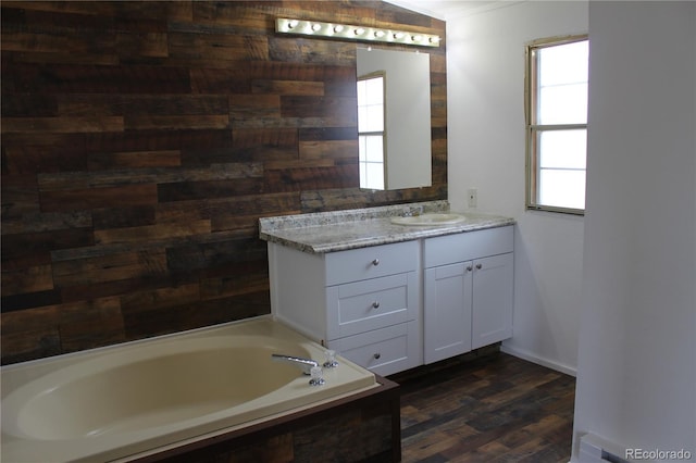1692 US Highway 24, Leadville, CO 80461 - bathroom with wood finished floors, vanity, a bath, and baseboards