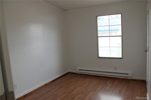 1692 US Highway 24, Leadville, CO 80461 - empty room featuring a baseboard heating unit, wood finished floors, and baseboards