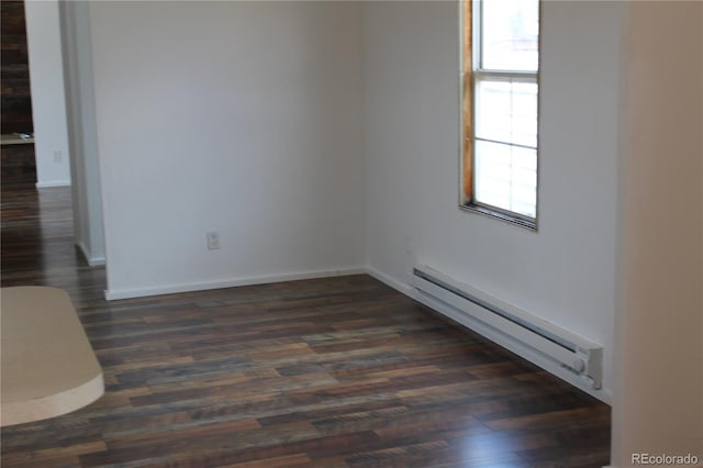 1692 US Highway 24, Leadville, CO 80461 - empty room featuring a baseboard heating unit, dark wood finished floors, and baseboards