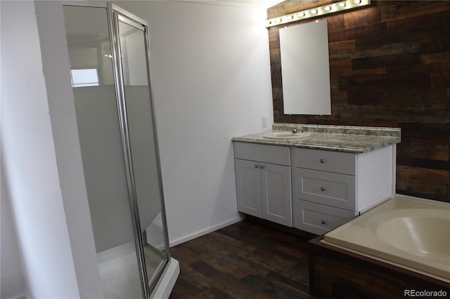 1692 US Highway 24, Leadville, CO 80461 - full bathroom featuring a shower stall, wood finished floors, vanity, and wood walls