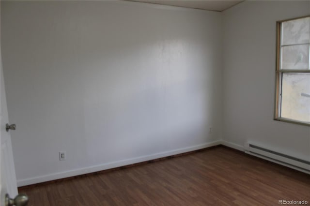 1692 US Highway 24, Leadville, CO 80461 - unfurnished room featuring dark wood finished floors, a baseboard heating unit, and baseboards