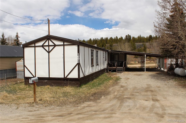 1692 US Highway 24, Leadville, CO 80461 - view of outbuilding featuring an attached carport and driveway