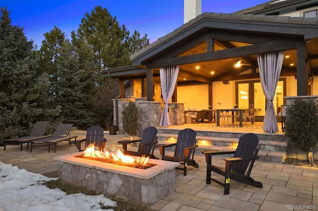 patio terrace at dusk with an outdoor fire pit