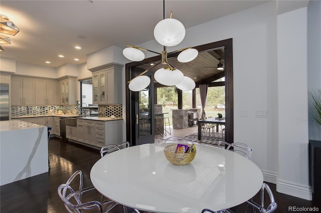 dining room featuring dark wood finished floors and recessed lighting