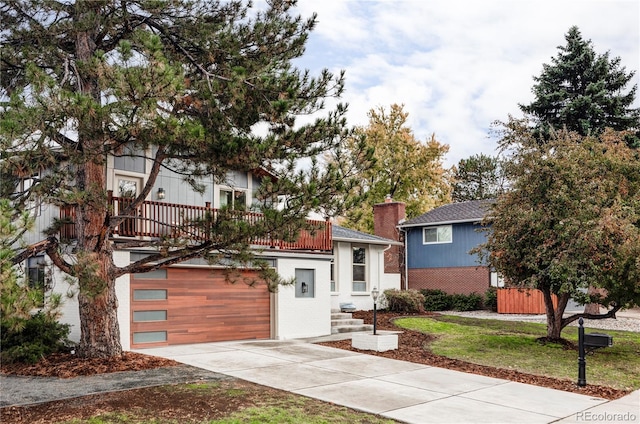 view of front of home featuring a garage and a front lawn