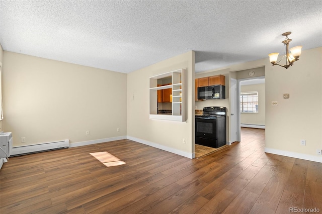 unfurnished living room with a textured ceiling, dark hardwood / wood-style floors, baseboard heating, and a notable chandelier