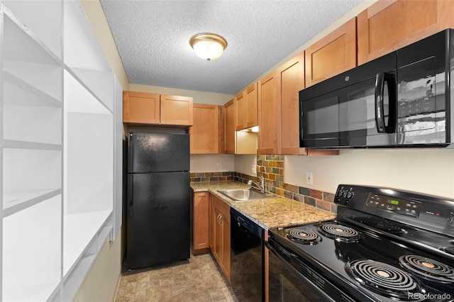 kitchen with black appliances, sink, decorative backsplash, a textured ceiling, and light stone counters