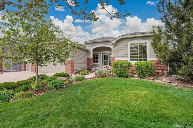20591 E Weaver Ave, Aurora, CO 80016 - view of front facade with brick siding, driveway, an attached garage, and a front lawn