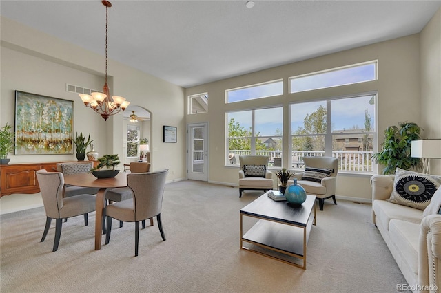 20591 E Weaver Ave, Aurora, CO 80016 - dining space featuring a chandelier and light colored carpet