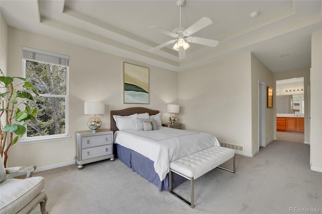 20591 E Weaver Ave, Aurora, CO 80016 - bedroom featuring a raised ceiling, light colored carpet, and a ceiling fan