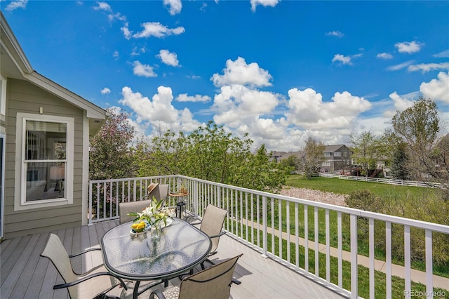 20591 E Weaver Ave, Aurora, CO 80016 - deck with outdoor dining area and a yard