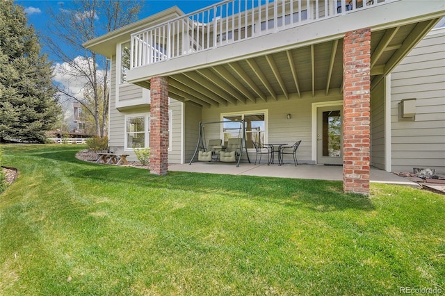 20591 E Weaver Ave, Aurora, CO 80016 - back of property featuring a patio area, a lawn, and a balcony