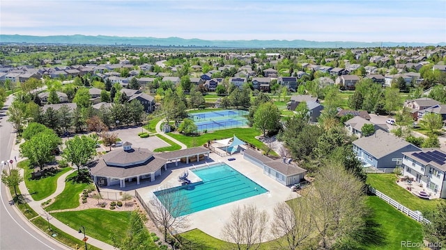 20591 E Weaver Ave, Aurora, CO 80016 - aerial perspective of suburban area with a pool area and a mountainous background