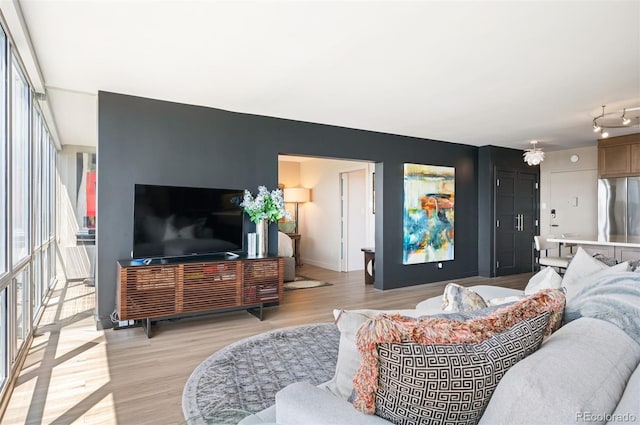 3100 E Cherry Creek S Drive 1403, Denver, CO 80209 - living room with light wood-style flooring and baseboards