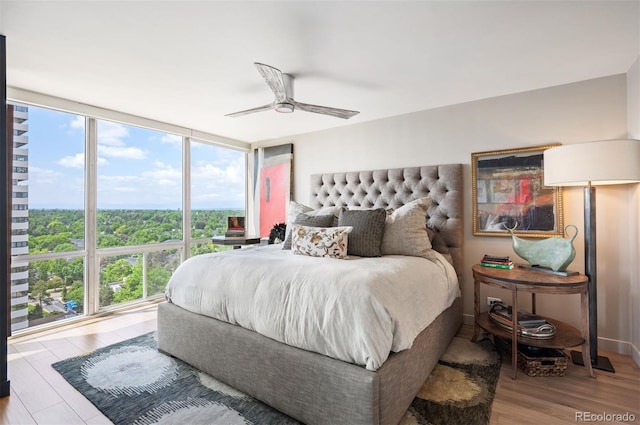 3100 E Cherry Creek S Drive 1403, Denver, CO 80209 - bedroom featuring floor to ceiling windows, wood finished floors, and a ceiling fan
