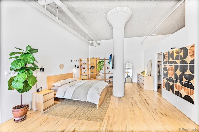 2000 Arapahoe St Unit 503, Denver, CO 80205 - bedroom with wood finished floors and a towering ceiling