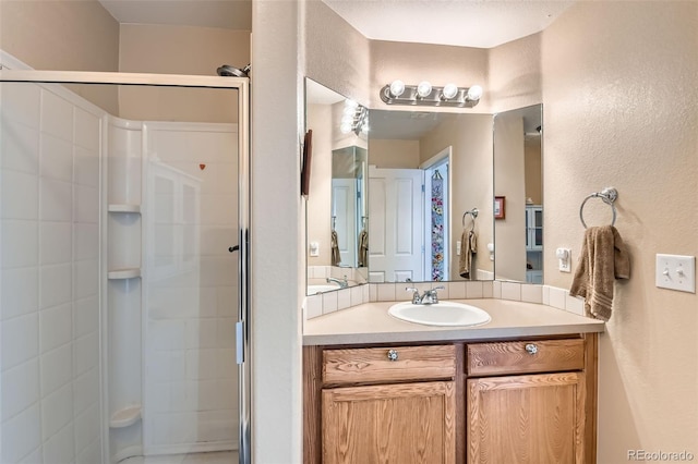 bathroom featuring vanity and walk in shower