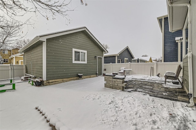 view of snow covered house