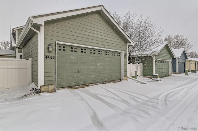 view of snow covered garage