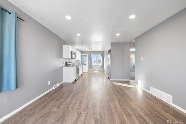 unfurnished living room featuring light wood-type flooring