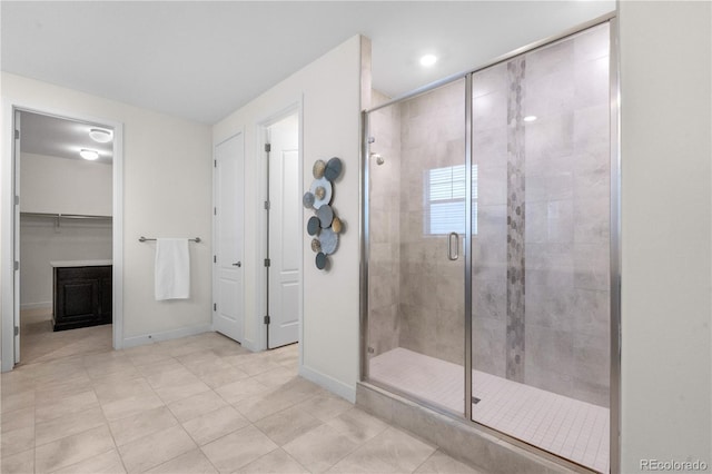 8814 S Winnipeg Ct, Aurora, CO 80016 - full bathroom featuring a shower stall, tile patterned floors, recessed lighting, and a walk in closet