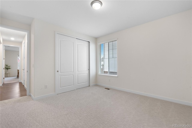 8814 S Winnipeg Ct, Aurora, CO 80016 - unfurnished bedroom featuring carpet floors and a closet