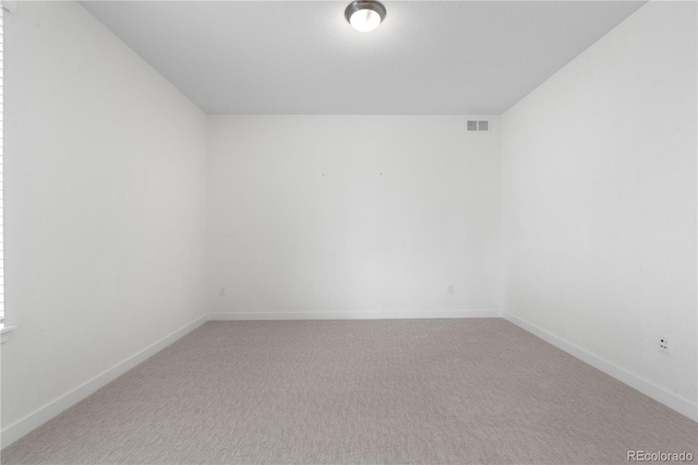 8814 S Winnipeg Ct, Aurora, CO 80016 - unfurnished room featuring light carpet and baseboards
