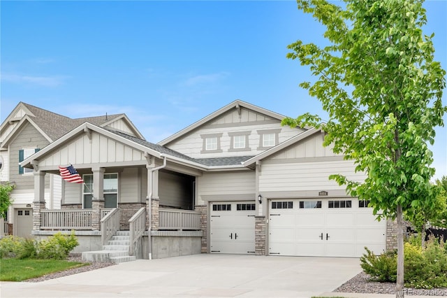 8814 S Winnipeg Ct, Aurora, CO 80016 - craftsman-style house with board and batten siding, driveway, a porch, and roof with shingles