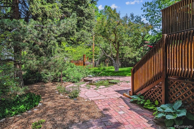 9113 E Evans Way, Denver, CO 80231 - view of yard featuring a patio