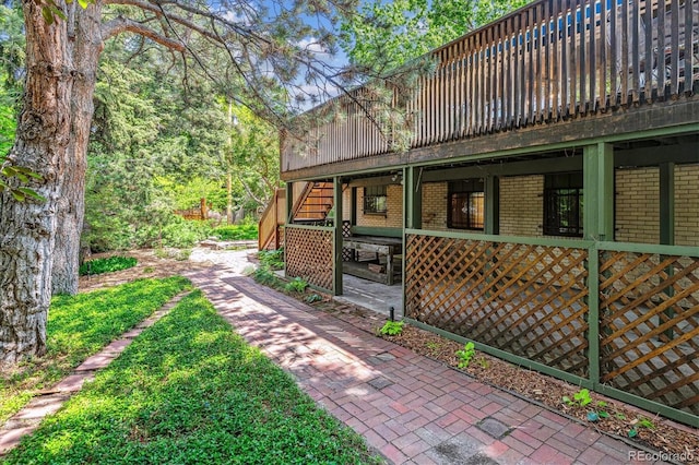 9113 E Evans Way, Denver, CO 80231 - view of property exterior featuring brick siding and stairway
