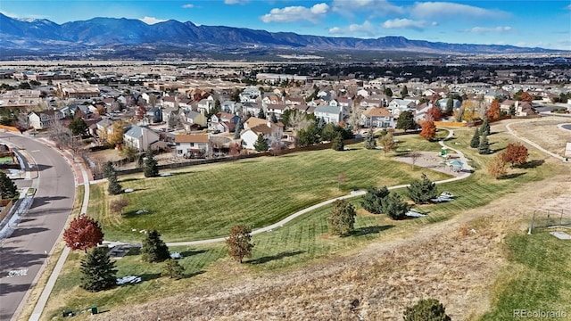 birds eye view of property with a mountain view