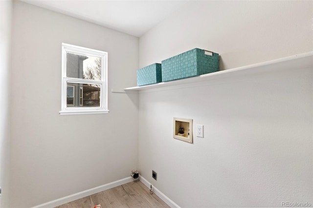 laundry room with hookup for a washing machine and light hardwood / wood-style floors