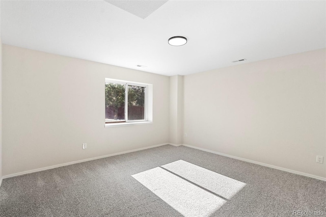 unfurnished room featuring carpet flooring