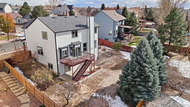 back of property with a wooden deck