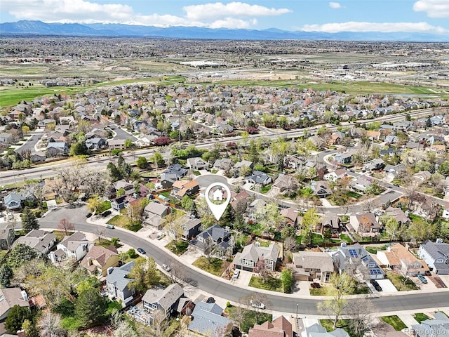 drone / aerial view featuring a mountain view and a residential view
