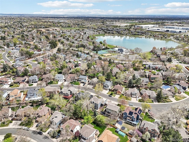 birds eye view of property with a water view and a residential view