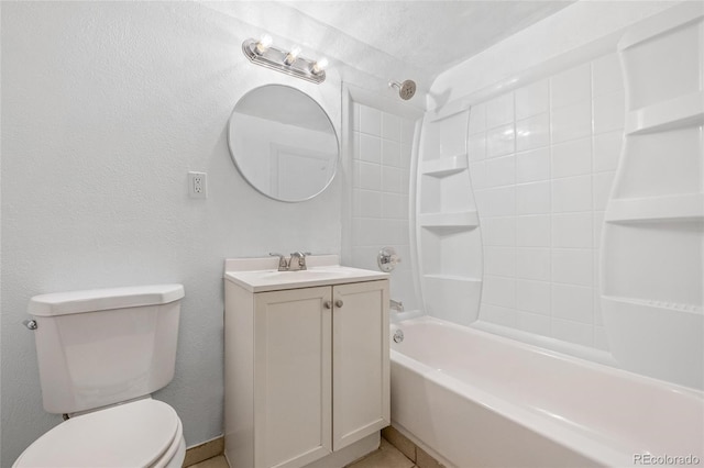 full bathroom featuring washtub / shower combination, vanity, and toilet